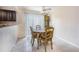 Bright dining area with a round table and four chairs, located near the kitchen at 807 Hunters Ct, Brandon, FL 33511