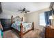 Main bedroom with a large bed, dresser, and ceiling fan at 807 Hunters Ct, Brandon, FL 33511