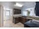 Kitchen features dark wood cabinets, granite countertops, and a view into the dining area at 807 Hunters Ct, Brandon, FL 33511