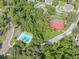 Community tennis court and pool area with surrounding trees at 807 Hunters Ct, Brandon, FL 33511