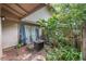 Private patio with fire pit, lush landscaping, and sliding glass doors at 807 Hunters Ct, Brandon, FL 33511