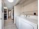 Laundry room with washer, dryer, and shelving at 807 Hunters Ct, Brandon, FL 33511