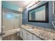 Bathroom with granite countertop vanity and a shower/tub combo at 807 Hunters Ct, Brandon, FL 33511