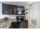 Galley kitchen with dark wood cabinets at 807 Hunters Ct, Brandon, FL 33511
