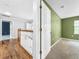 Upstairs hallway with wood floors and access to bedrooms at 12731 Timber Run, Dade City, FL 33525