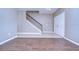 Inviting entryway features wood-look flooring and a staircase with decorative wrought iron spindles at 5365 Shasta Daisy Pl, Land O Lakes, FL 34639