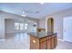 Spacious eat-in kitchen with granite-topped island and views to adjacent living area at 5365 Shasta Daisy Pl, Land O Lakes, FL 34639