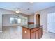 Modern kitchen island with granite countertops; the floor is tile and the room is well lit at 5365 Shasta Daisy Pl, Land O Lakes, FL 34639