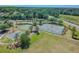 Aerial view of community tennis and basketball courts for active recreation at 5365 Shasta Daisy Pl, Land O Lakes, FL 34639