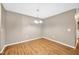 Simple dining room featuring wood flooring at 9481 Highland Oak Dr # 606, Tampa, FL 33647