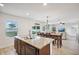 Island kitchen with granite countertops and double sink at 11824 Myrtle Rock Dr, Riverview, FL 33578