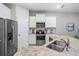 Modern kitchen with stainless steel appliances and granite countertops at 7828 Stonebrook Cir, Wesley Chapel, FL 33545