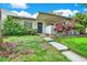 Front exterior view showing landscaping and walkway at 110 Tads Trl, Oldsmar, FL 34677