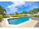 Refreshing swimming pool surrounded by lush greenery and ample lounge space, perfect for relaxation at 944 Apollo Beach Blvd, Apollo Beach, FL 33572