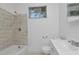 Clean bathroom with a shower/tub combo and white vanity at 405 E Dr Martin Luther King Jr Blvd, Tampa, FL 33603