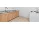 Simple kitchen featuring wood cabinets and tile floors at 405 E Dr Martin Luther King Jr Blvd, Tampa, FL 33603