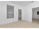 Open living room with white walls and tile floors at 405 E Dr Martin Luther King Jr Blvd, Tampa, FL 33603