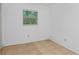 Small bedroom with tile floors and a window with blinds at 405 E Dr Martin Luther King Jr Blvd, Tampa, FL 33603