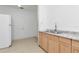 Efficient kitchen with wood cabinets and appliances at 405 E Dr Martin Luther King Jr Blvd, Tampa, FL 33603