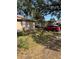 Tan house exterior with a wooden door and steps at 405 E Dr Martin Luther King Jr Blvd, Tampa, FL 33603
