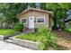 Tan house with white door and steps at 405 E Dr Martin Luther King Jr Blvd, Tampa, FL 33603