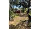 View down a tree-lined alley with a red car parked at 405 E Dr Martin Luther King Jr Blvd, Tampa, FL 33603