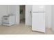 White appliances and wood cabinets in this galley kitchen at 405 E Dr Martin Luther King Jr Blvd, Tampa, FL 33603