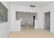 Open living room with white walls and tile floors at 405 E Dr Martin Luther King Jr Blvd, Tampa, FL 33603