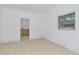 Spacious living area with tile floors and access to kitchen at 405 E Dr Martin Luther King Jr Blvd, Tampa, FL 33603
