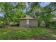 Small backyard with a detached structure and grassy area at 405 E Dr Martin Luther King Jr Blvd, Tampa, FL 33603