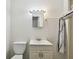 Simple bathroom with toilet and vanity at 7024 Filbert Ln, Tampa, FL 33637