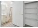 Clean bathroom with vanity, shower, and storage at 7024 Filbert Ln, Tampa, FL 33637