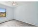 Bright bedroom with ceiling fan, tile floor, and ample closet space at 7024 Filbert Ln, Tampa, FL 33637