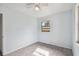 Bedroom with window, ceiling fan, and tile floors at 7024 Filbert Ln, Tampa, FL 33637