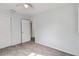 Bedroom with door to hallway, closet, and tile floor at 7024 Filbert Ln, Tampa, FL 33637