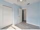 Bedroom with white sliding doors and closet at 7024 Filbert Ln, Tampa, FL 33637