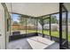 Spacious screened porch overlooking backyard at 7024 Filbert Ln, Tampa, FL 33637