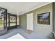 Screened porch with door to backyard at 7024 Filbert Ln, Tampa, FL 33637