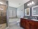 Elegant bathroom with double vanity and large shower at 18933 Sunterra Dr, Land O Lakes, FL 34638