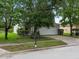 Two-story house with a white garage door and front yard at 18933 Sunterra Dr, Land O Lakes, FL 34638