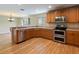 Spacious kitchen with stainless steel appliances and wood cabinets at 18933 Sunterra Dr, Land O Lakes, FL 34638