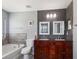 Bathroom with double vanity, garden tub, and toilet at 18933 Sunterra Dr, Land O Lakes, FL 34638