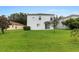 Spacious backyard with green lawn and two-story house at 18933 Sunterra Dr, Land O Lakes, FL 34638