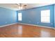 Bright bedroom with light blue walls and wood floors at 18933 Sunterra Dr, Land O Lakes, FL 34638