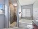 Bathroom with shower, tub and wood-look tile at 18933 Sunterra Dr, Land O Lakes, FL 34638