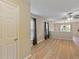 Living room with hardwood floors and a view of the kitchen at 18933 Sunterra Dr, Land O Lakes, FL 34638