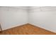 Spacious walk-in closet with wire shelving and wood laminate flooring at 18933 Sunterra Dr, Land O Lakes, FL 34638