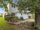 Two-story house with a white garage door and landscaping at 18933 Sunterra Dr, Land O Lakes, FL 34638