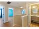 Bright hallway with access to bedrooms and bathroom at 18933 Sunterra Dr, Land O Lakes, FL 34638
