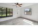 Bright living room featuring tile floors and large windows at 7024 Filbert Ln, Tampa, FL 33637